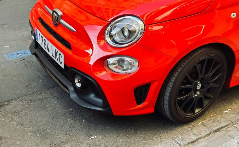 a red car parked on the side of the road